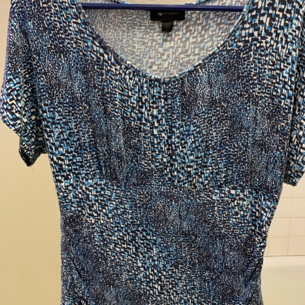 Blue, black and white top.